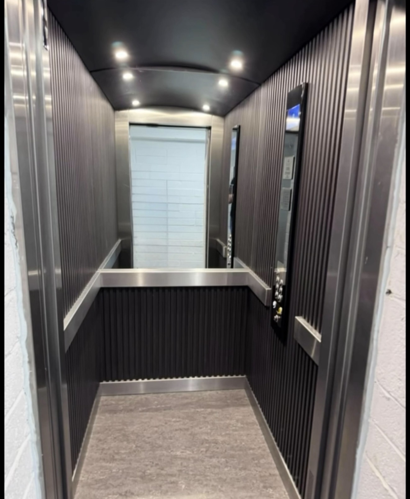 Refurbished lift interior with modern lighting