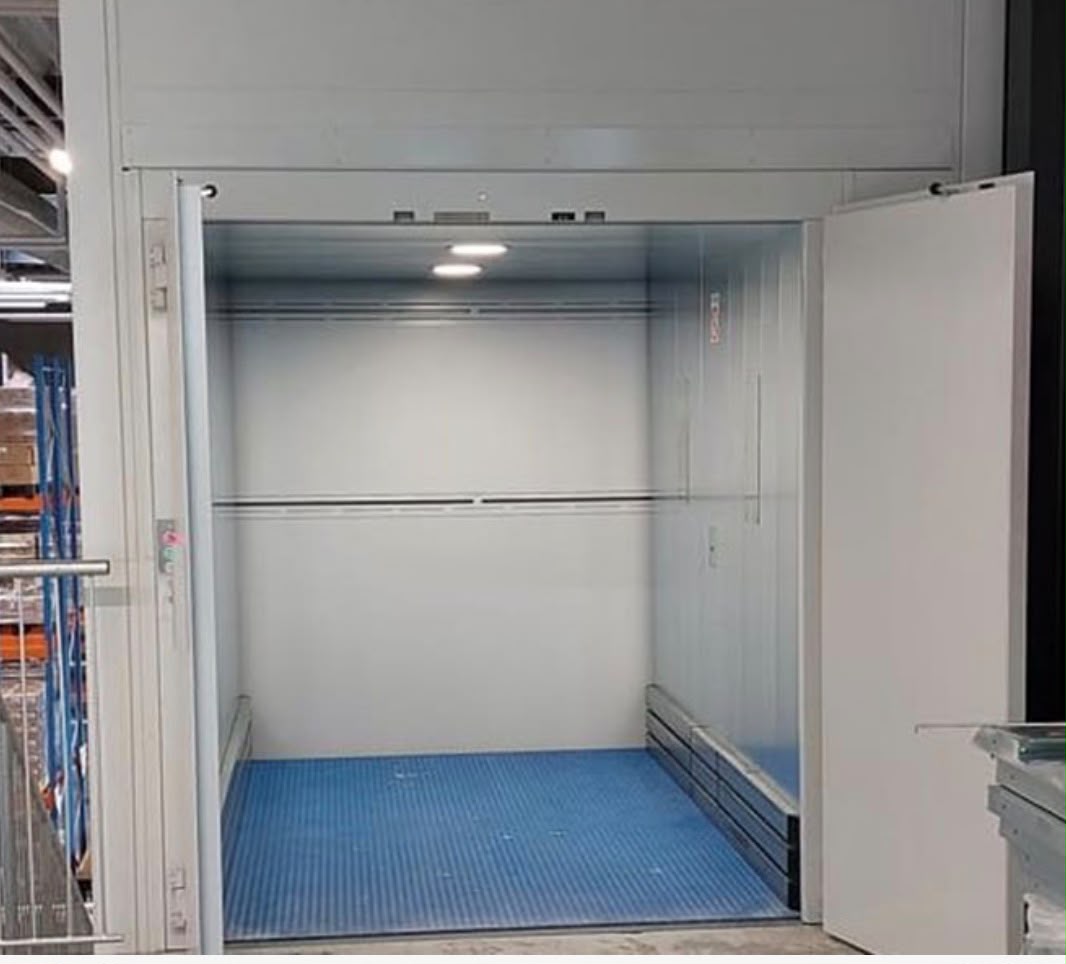 Goods lift with blue floor