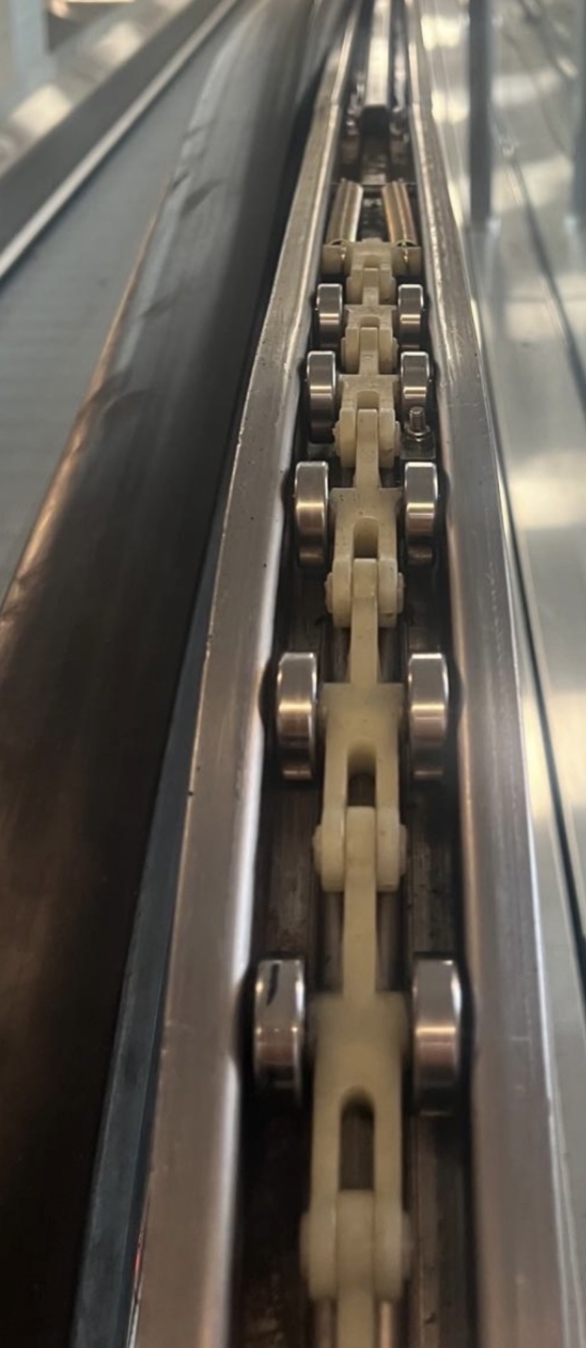 Newel rollers replaced during escalator handrail replacement work